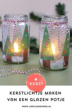 two mason jars decorated with christmas trees and lights