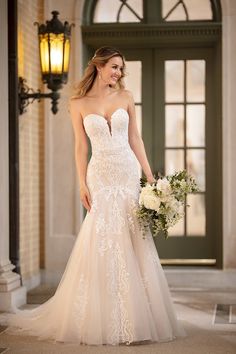 a woman in a wedding dress holding a bouquet