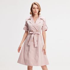 A safe bet in any wardrobe, the trench dress is available here with a tailored collar and wide flaps on the shoulders that give character to the silhouette. Adorned with refined metal buttons, generously flared, this timeless piece is cut from a breathable poplin slightly stretch. To feminize with heels or to wear with sneakers for a more casual and current look. Main fabric:  62% Cotton 35% Nylon 3% Elastane Machine wash gentle cycle (30 degrees max) Elegant A-line Shirt Dress With Button Closure, Semi-formal Dress With Lapel Collar And Button Closure, Elegant Collared Dresses With Button Closure, Elegant Collared Shirt Dress For Business, Belted Midi Dress For Office Wear, Chic A-line Blazer Dress For Work, Casual Belted Midi Dress For Office Wear, Chic Knee-length Jacket Dress With Hidden Buttons, Elegant Knee-length Belted Blazer Dress