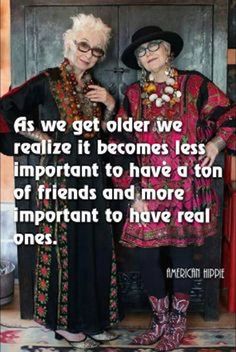 two women standing next to each other in front of a wooden door with the caption as we get older, we realize it becomes less important to have tons of friends and more important