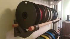 a rack with many different colored reels on it