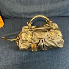 This Beautiful Marc By Marc Jacobs Gold Bag . Is In New Condition. T Strap Has Never Being Use & Bag Use Just Ones , As You See In Pictures, ( T Lined Has 2 Small Black / Pen Dots Plz Refer In T Pic) . Original Price 378$. It Comes With Dust Bag. Black Pen, Gold Bag, Marc Jacobs Bag, T Strap, Marc By Marc Jacobs, Cow Leather, Marc Jacobs, Dust Bag, Cow