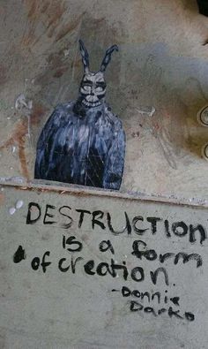 graffiti on the side of a building with an image of a bird and words describing destruction is a form of creation