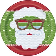 a paper plate with a santa clause wearing sunglasses and a knitted christmas sweater on it