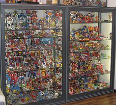 a large display case filled with lots of toy figurines and action figure toys