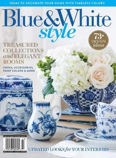 the cover of blue and white style magazine with flowers in vases, china accessories