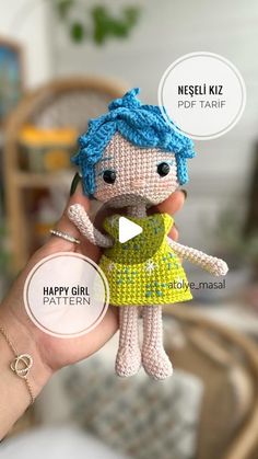 a hand holding a small crocheted doll with words above it that say happy girl