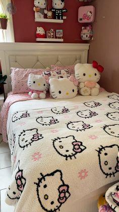 a bedroom with hello kitty bedding and pink walls