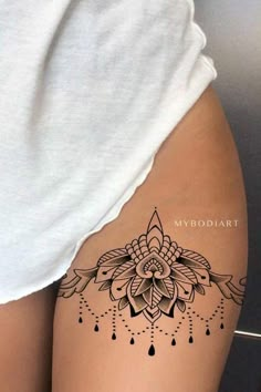 a woman's thigh with a tattoo on it