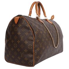 Authentic, pre-loved classic Louis Vuitton brown Speedy 40 handbag tote. Features monogram canvas, double rolled handles, zip-top closure, brown textile lining with slip pocket. Perfect bag for the day, evening, and traveling use. I added a non-LV heavy-gauge shoulder strap to use as a shoulder crossbody bag. Authenticity date code: MB0050 Strap drop: 22" Non LV Travel Satchel In Monogram Canvas, Monogram Canvas Satchel For Travel, Brown Monogram Canvas Bag With Large Capacity, Travel Satchel In Monogram Canvas With Large Capacity, Travel Satchel With Large Capacity In Monogram Canvas, Brown Coated Canvas Bag For Everyday Luxury, Top Handle Brown Travel Bag With Dust Bag, Brown Coated Canvas Travel Bag With Handles, Monogram Canvas Tote Travel Bag