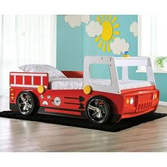 a child's firetruck bed with wheels on the bottom and side rails