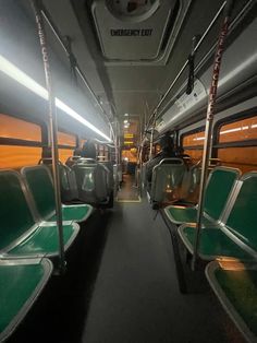 the inside of a bus with green seats and yellow walls, in an empty area