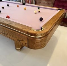 a pool table with several balls on it