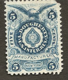 a blue and white stamp with an eagle on it's back side, in the middle