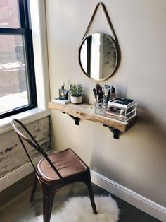 a chair sitting in front of a mirror next to a window