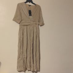 Miss Ipekyol Khaki Elbise Dress Usa Size 8 Khaki Color Beige Pleated V-neck Maxi Dress, Elegant A-line Maxi Dress In Rayon, Pleated Knee-length Viscose Dress, Knee-length Pleated Viscose Dress, Beige Pleated Maxi Dress, Pleated V-neck Midi Dress In Viscose, Beige Pleated Maxi Dress For Party, Flowy Pleated Maxi Dress With Short Sleeves, Knee-length Pleated Viscose Midi Dress