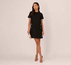 Elevate your wardrobe with our sophisticated tweed sheath dress, designed for effortless elegance. Featuring a shirred crew neckline and chic four-button accents at the hips, this short sleeve dress exudes timeless style. With a hidden zipper closure at the center back and no waist seam, it ensures a seamless fit that flatters all body types. Perfect for both work and special occasions, embrace comfort and refinement in every wear with this versatile day dress. Style Number: AP1D105605 Brand: AD Fitted Black Tweed Office Dress, Black Tweed Dress With Short Sleeves For Spring, Fitted Tweed Dress With Buttons And Short Sleeves, Black Short Sleeve Tweed Dress For Spring, Luxury Black Knee-length Tweed Dress, Black Tweed, Long Midi Dress, Midi Cocktail Dress, Black Cocktail Dress