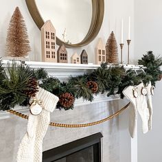 a mantle with stockings and pine cones on it