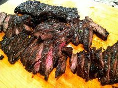 some steaks are on a cutting board ready to be cooked