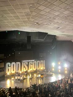 a large group of people standing on top of a stage in front of a crowd