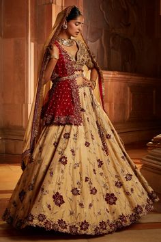 Gold tissue lehenga with attached can-can all-over floral embroidery. Comes with embroidered padded choli, worked belt and contrasting red tulle dupatta.
Component: 4
Pattern: Embroidered
Type Of Work: Floral Pattern
Neckline: Plunged V-Neck
Sleeve Type: Half
Fabric: Tissue, Tulle
Color: Gold
Other Details: 
Bead hem blouse and dupatta
Cutwork hem
Note:
Only selling the red dupatta
Contact customer service to get the 2nd dupatta
Occasion: Bride, Wedding - Aza Fashions Floor-length Kundan Sets For Reception, Anarkali Pre-draped Saree With Tilla For Wedding, Kundan Lehenga With Tilla For Navratri, Navratri Kundan Lehenga With Tilla Details, Kundan Tilla Lehenga For Navratri, Traditional Lehenga With Tilla For Reception, Semi-stitched Tilla Lehenga For Festive Occasions, Bollywood Style Lehenga With Tilla For Eid, Wedding Pre-draped Saree With Tilla