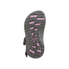 the sole of a shoe with pink and grey trims on it's outstep