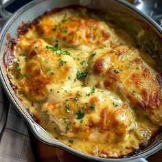 a casserole dish with chicken and cheese