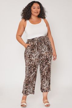 Introducing our Missy Plus Elastic Waistband Pants. Featuring front tie, drawstring waistband, ruched hems and side pockets. This garment moves with you throughout the day for a comfortable, flexible fit. . Measurement (Based on size 2X)- Inseam: 28"- Rise (To top edge of band): 14.5"- Leg Opening: 26" 100% Rayon Drawstring Tie-side Pants For Loungewear, Stretch Tie-side Bottoms For Loungewear, Casual Tie-side Bottoms With Tie Waist, Stretch Tie Waist Pants For Loungewear, Stretch Vacation Bottoms With Tie Waist, Relaxed Fit Bottoms With Elastic Waistband And Tie Sides, Relaxed Fit Tie-side Bottoms With Elastic Waistband, Relaxed Fit Drawstring Tie-side Bottoms, Waistband Pants