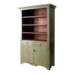 an old wooden bookcase with two doors and drawers