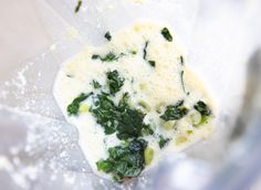 spinach and cheese are mixed together in a blender