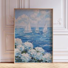 there is a painting on the wall with flowers and sailboats in the water behind it