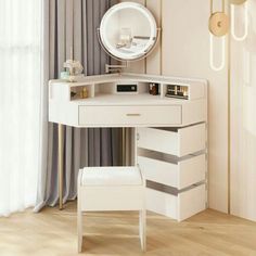 a white desk with drawers and a mirror