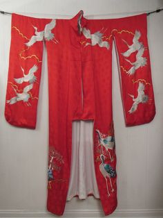 "Vintage red silk brocade Uchikake ceremonial kimono robe, jacket. Has metallic silver and gold embroidery. Elegant cranes, sign of good fortune, longevity and faithfulness. Made to be worn as outerwear. Long to have a train effect, hem is padded. Lined in white silk. Measures 69\" long and 51\" across the top from sleeve end to sleeve end." Vintage Red Kimono For Wedding, Red Long Kimono For Wedding, Long Red Kimono For Wedding, Traditional Red Silk Kimono, Traditional Red Kimono For Tea Ceremony, Wedding Embroidered Kimono With Kimono Sleeves, Vintage Red Kimono For Tea Ceremony, Ceremonial Silk Kimono With Kimono Sleeves, Ceremonial Vintage Kimono