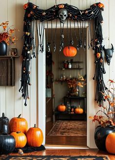 an entry way decorated for halloween with pumpkins and decorations