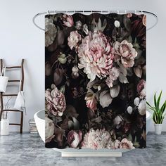 a black and white floral shower curtain with pink flowers