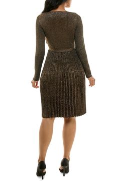 A fit-and-flare silhouette hugs your figure in a long-sleeve sweater dress with a ribbed texture and metallic shine. 39 1/2" length Scoop neck
 Long sleeves 78% rayon, 22% polyester Machine wash, tumble dry Imported Model stats: 5'10" height, 32" bust, 25" waist, 36" hip. Flare Sweater Dress, Long Sleeve Sweater Dress, Ribbed Texture, Sleeve Sweater, Fit & Flare, Fit And Flare, Scoop Neck, Sweater Dress, Long Sleeves