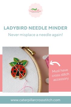 the ladybird needle minder is on display in front of a pink and white background