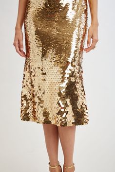 Shine on in Elie's Strapless Midi Dress in modern Ombre Gold Sequins. Perfect for special occasions and weddings, this eye-catching dress ensures you stand out with its captivating patina of metallic sequins in a graduated design with smaller sequins through the body ending in a larger playful sequin at the hem.     Limited Edition 50th Anniversary Collection    Elie Tahari Exclusive    Strapless Ombre Gold Sequin Midi Dress    50% Nylon, 50% Polyester    Runs true to Size    Length From Shoulde Sequin Midi Dress, Strapless Midi Dress, Cocktail Evening Dresses, Long Sleeve Short Dress, Elie Tahari, Gold Sequins, Gold Sequin, Shine On, Denim Coat