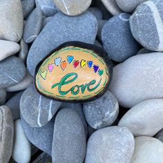 a rock with the word love painted on it