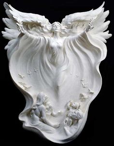 a white sculpture with angel wings on it's head and two children in the center