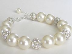 bracelet Classic Crystal Bracelets For Wedding, Classic White Crystal Bracelet For Wedding, Pearl Crystal Bracelet For Wedding, Pearl Crystal Bracelet For Wedding With Round Beads, Wedding Pearl Crystal Bracelet With Round Beads, Adjustable Round Pearl Bracelet For Wedding, Elegant White Bracelet For Bridal Shower, Adjustable Round Crystal Bracelet For Wedding, Classic Adjustable Beaded Bracelets For Wedding