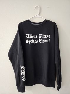 "Wicca Phase Springs Eternal \"task force\" or \"cast spells write checks\" GBC crewneck sweatshirt Handmade to order with heat transfer vinyl ♡ Sizes S-4XL available Select your design: either the abbreviated WPSE front pocket logo with \"cast spells write checks\" on back, or the full wicca phase springs eternal\" font with \"task force\" written on the back Unisex fashion/design but runs in men's sweatshirt sizes, so please take this into consideration when selecting your size! 60% cotton, 40 Pocket Logo, Transfer Vinyl, Crewneck Sweater, Heat Transfer Vinyl, Unisex Fashion, Heat Transfer, Crew Neck Sweater, Front Pocket, Mens Sweatshirts