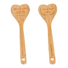 two wooden spoons with hearts on them, one is engraved and the other has a heart