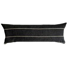 a black and white striped pillow on a white background