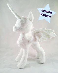 a white stuffed animal with wings on it's head and the words sewing pattern above it