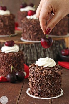 chocolate cake with whipped cream and cherries on top