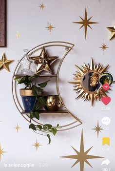 there are many stars on the wall and one has a crescent shaped shelf in it