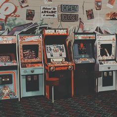 several arcade machines lined up against a wall