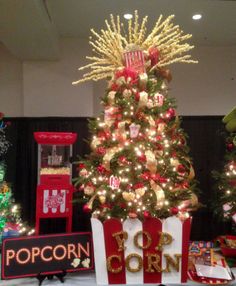 the christmas tree is decorated with gold and red decorations