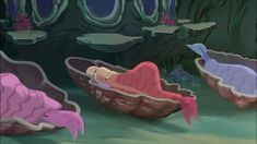 the little mermaid is laying on her stomach in an empty shell and looking at another fish